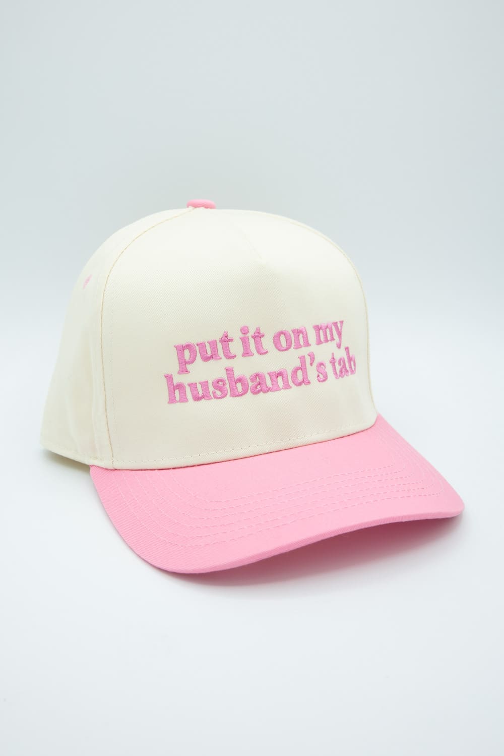 Put It On My Husband’s Tab Trucker Hat for Women in Pink/Tan