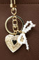 Small Pearl Bow Heart Purse Charm in Gold