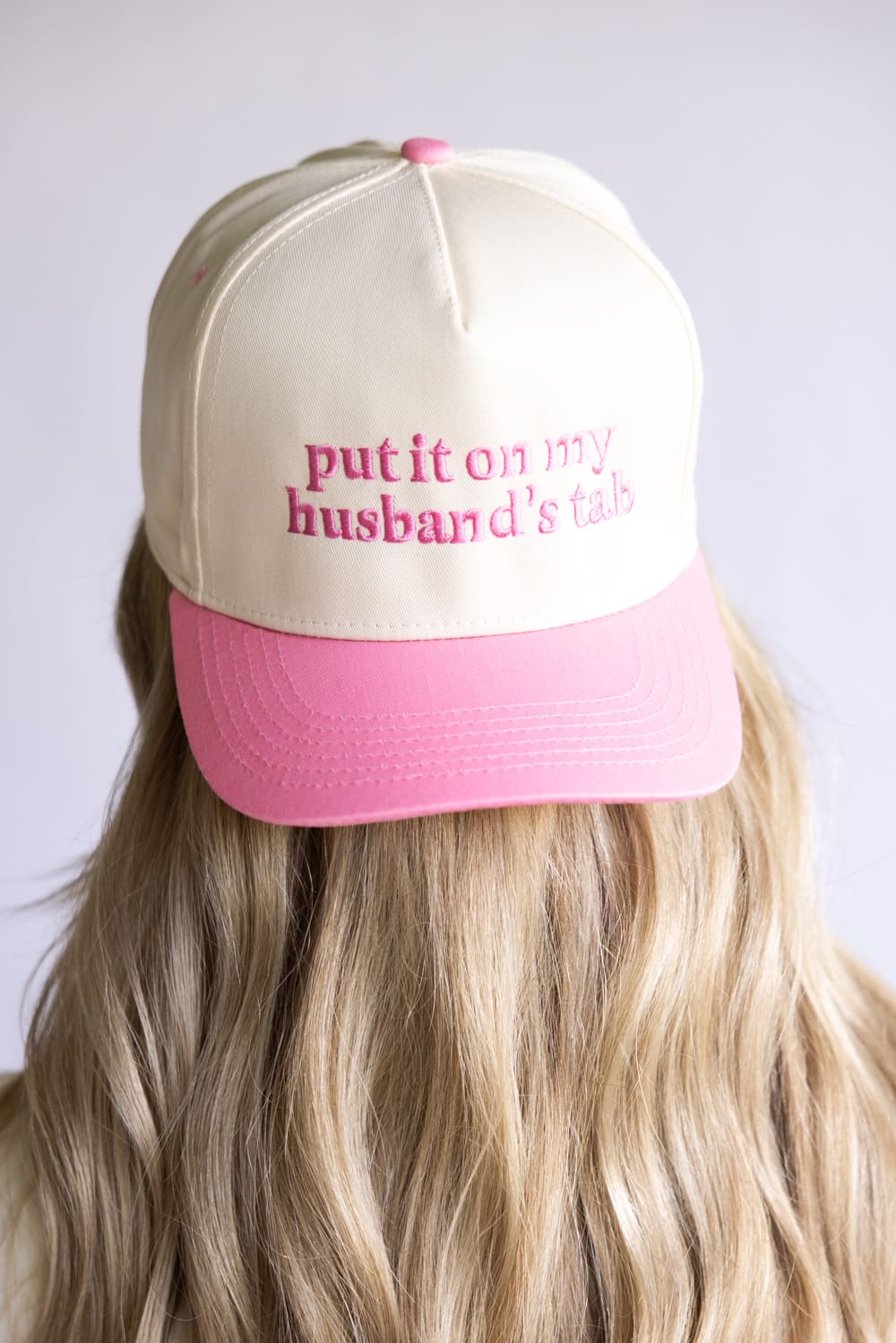 Put It On My Husband’s Tab Trucker Hat for Women in Pink/Tan