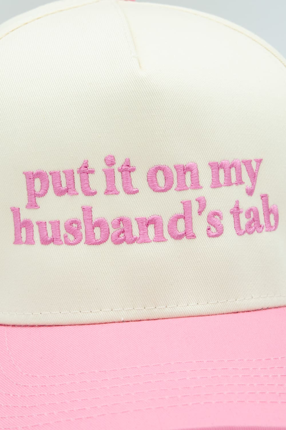 Put It On My Husband’s Tab Trucker Hat for Women in Pink/Tan