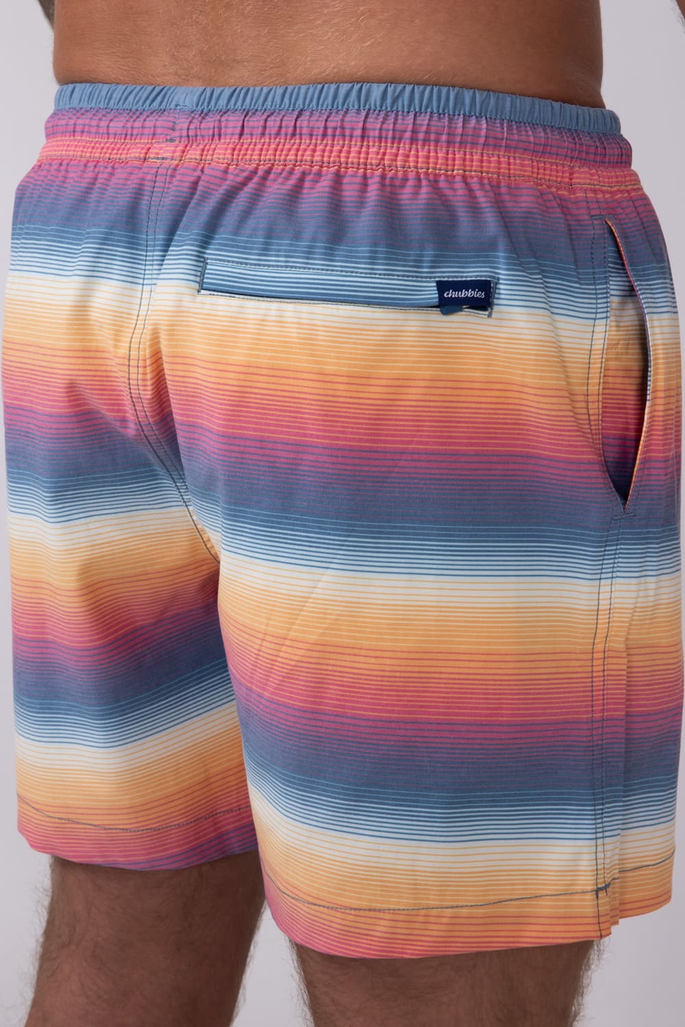 Chubbies Classic Lined Swim Trunks 5.5” Shorts for Men in Blue/Orange Gradient Stripe
