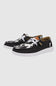 HEYDUDE Women’s Wendy Cow Print Shoes in Black/White